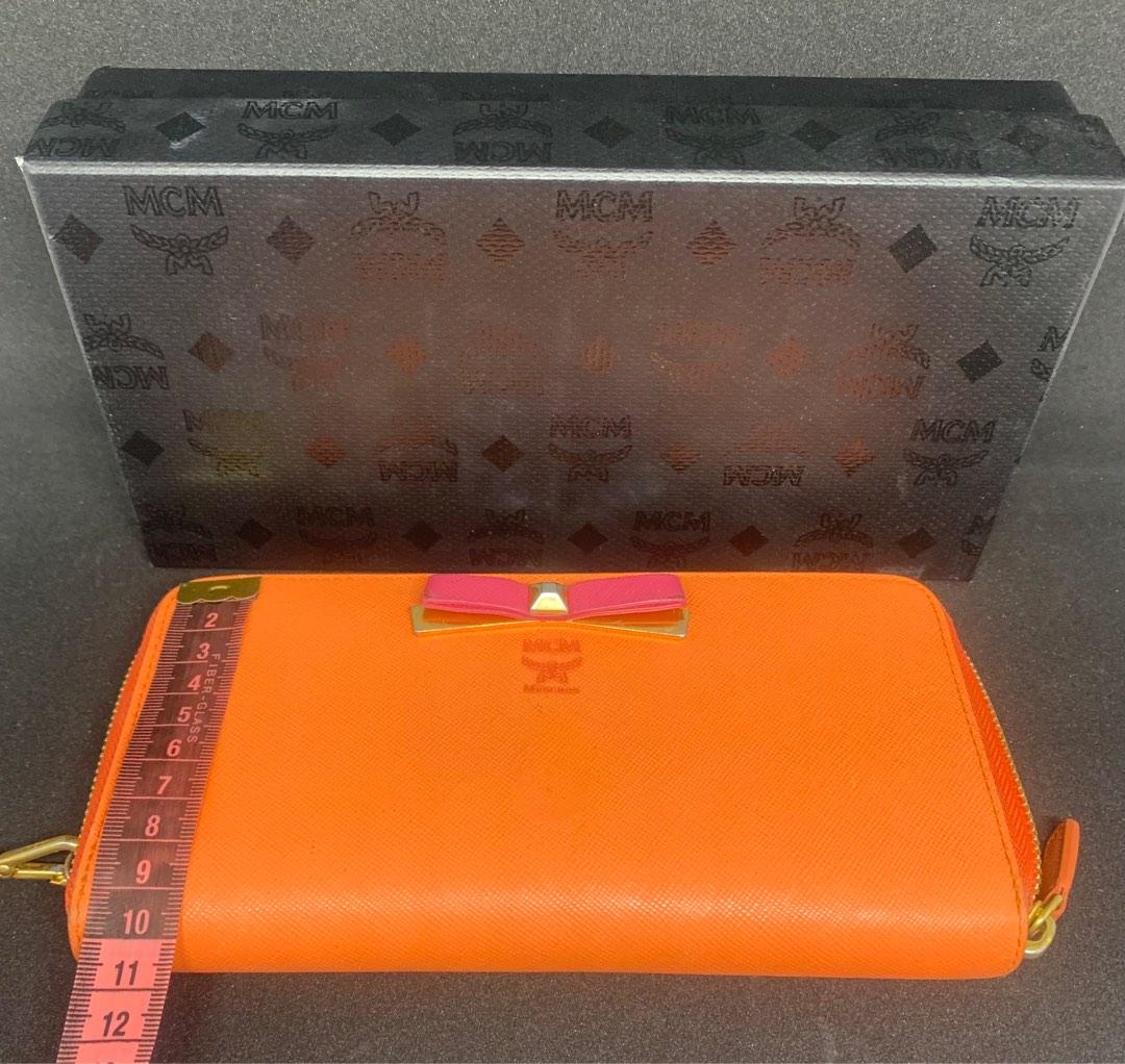 MCM wallet with wristlet (Category: Luxury Bags & Wallets) located in Cebu City. Submitted by joanofcebu (Listing ID 1186922405, Image 3). Description: Mcm wallet Bought in Germany - 2 way - zip closure - 12 credit card slots - 2 slip pockets - zip coin compartment - comes with box there are signs of usage pls pm to see the signs of use..