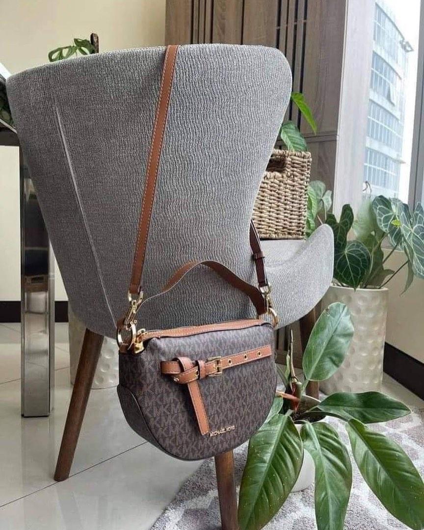 Michael Kors Emilia (Category: Luxury Bags & Wallets) located in Cavite. Submitted by LuxbyMarifrance (Listing ID 1186885201, Image 1). Description: 🏷 3,200 + SF 🛍 Michael Kors Emilia Half Moon Crossbody Small Saddle Bag Brown 📏 9”L x 8.5” H x 2.5” D 📌 with tag, care card, dust bag, paper bag ✨All trademarks, logos and brand names are the property of their respective owners. .