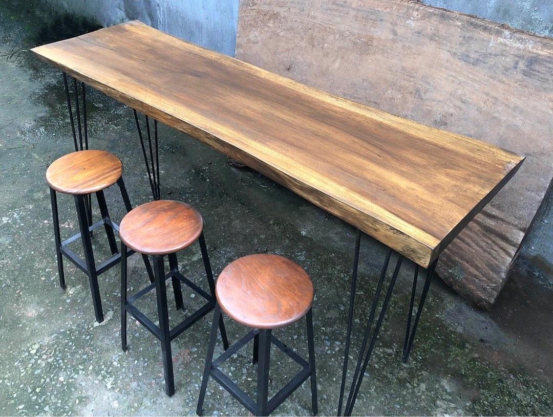 Acacia Slab Bar Table Set (Category: Tables & Sets) located in Pasig City. Submitted by holzph (Listing ID 1187137872, Image 1). Description: Doubling as a kitchen counter & bar table, this solid Acacia slab set has a casual twist that promotes socialization. 🌳 Available slabs on-hand measure 4-7ft which can sit 2-4 pax on one side. Send us a DM for slab availability. First, come first serve ✅.
