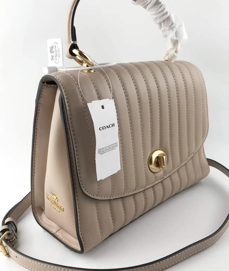 Coach top handle (Category: Cross-body Bags) located in Manila. Submitted by gff.daily_flower (Listing ID 1187059730, Image 3). Description: Complete inclusion tag gift receipt dust bag, care card and paper bag.