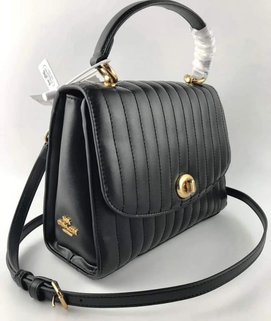 Coach top handle (Category: Cross-body Bags) located in Manila. Submitted by gff.daily_flower (Listing ID 1187059730, Image 1). Description: Complete inclusion tag gift receipt dust bag, care card and paper bag.