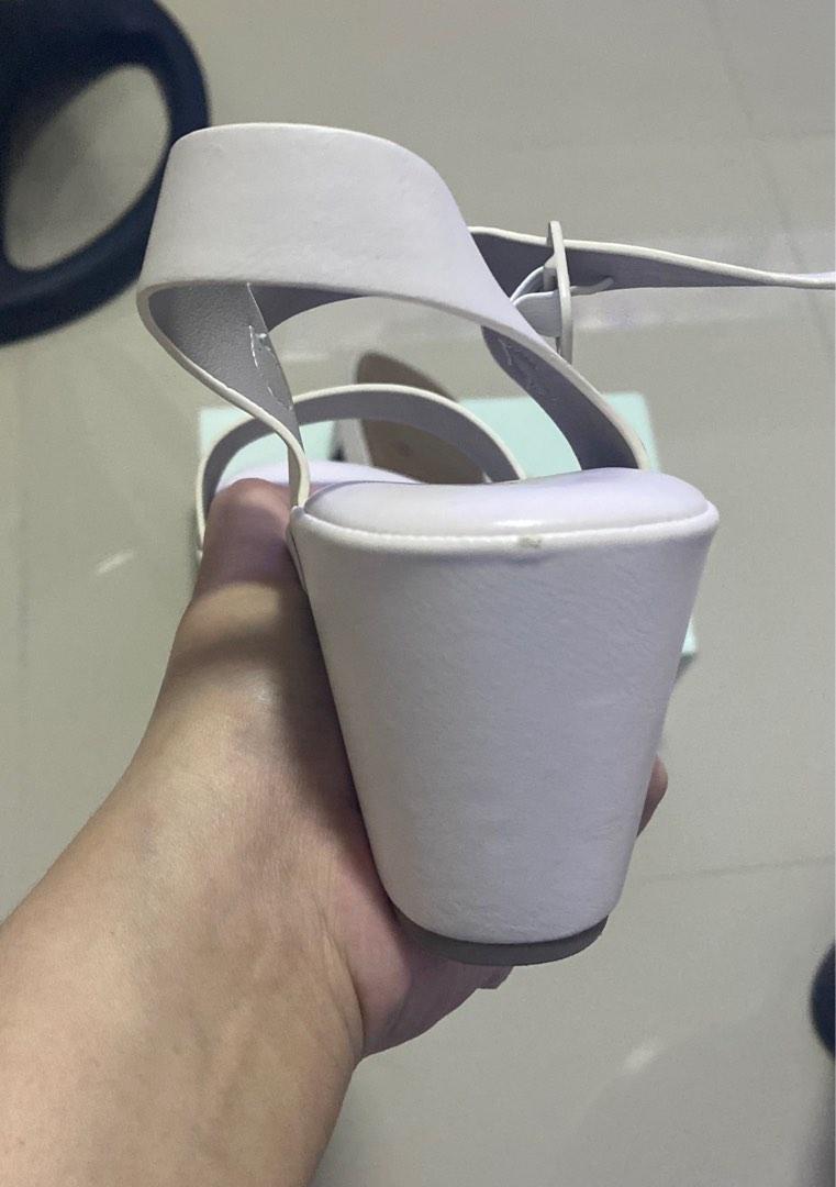 Suki Casual Sandals White (Category: Heels) located in San Fernando. Submitted by nyl001 (Listing ID 1187242059, Image 3). Description: Once lang po naisuot. P2,000 orig price sa mall 3 inches heel Size: 7 US Please see the uploaded photo for product details.