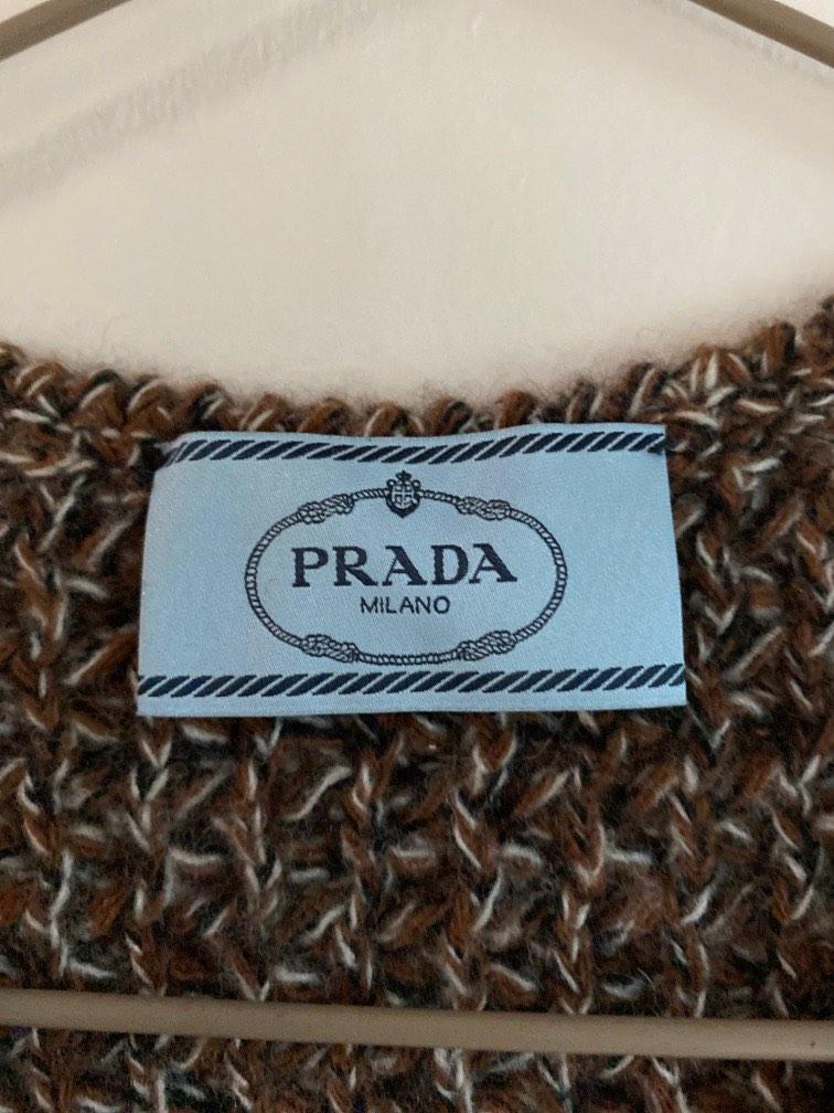 Authentic Prada vest (Category: Sleeveless) located in Singapore. Submitted by pristy102 (Listing ID 1187366299, Image 3). Description: Size 40 but really fits size 38 Pair with a white shirt for a funky but warm look Wool cashmere blend Never worn.