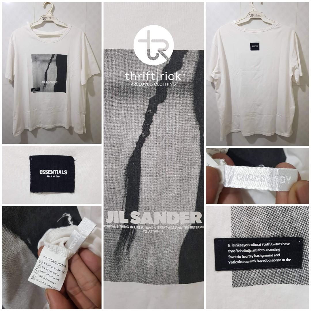 JIL SANDER × ESSENTIALS × CHOCO LADY WHITE PRINTED T-SHIRT (Category: Shirts) located in Indang. Submitted by thriftrick (Listing ID 1187282871, Image 2). Description: Size: Fits Medium-Semi Large Dimes: 22.5W ×26L Condition: Very Good Color Rate: 9.5/10 Issue: No necktag; Sign of usage l; needs wash Mode of Payment: Gcash Shipping: Shopee checkout (preferred by the seller) Strictly payment first policy Price: Php 650+ sf PLS. READ THIS 1. Paymen