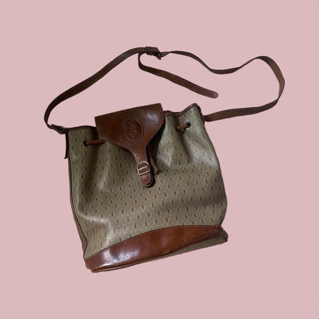 YSL Monogram Bucket Sling (Category: Luxury Bags & Wallets) located in Baguio. Submitted by stylehouseph (Listing ID 1187397925, Image 1). Description: 🤍 YSL Monogram Vintage Bucket Sling 🤍 Authentic Vintage (more than 35 yrs old) 🤍 RANK B 🤍 Flaw: Leather cracks on bottom part and on lip (leather parts needs restoration); Inner lining needs restitching and cleaning; Body is in very good condition 🤍 Valued at ₱14k up 🤍 Selling low @ ₱4000.