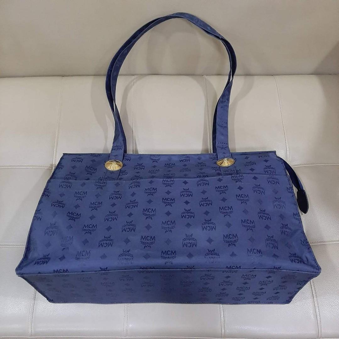 MCM Large Shoppers Bag (Category: Luxury Bags & Wallets) located in Taguig. Submitted by esa.agustin (Listing ID 1187683003, Image 2). Description: Original MCM blue nylon extra large shoppers bag. With cardcard, pouch and dust bag. Made in Germany..