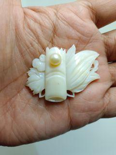 Carved mother of pearl obidome with akoya pearl