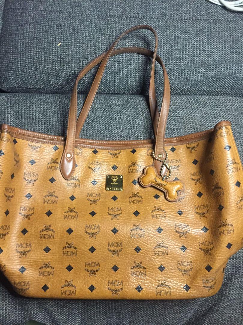 MCM Dogbone Tote (Category: Luxury Bags & Wallets) located in Baguio. Submitted by BagstacularbyJCT (Listing ID 1182598469, Image 2). Description: MCM Tote in Cognac Visettos. With dogbone charm. Details in pics. .