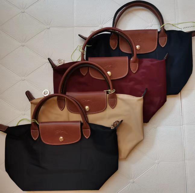 Longchamp Le Pliage Small Short Handle (Category: Luxury Bags & Wallets) located in San Juan City. Submitted by chicqui (Listing ID 1187858401, Image 1). Description: Reference : L1621089001 Dimensions : 9.1 in (L) x 8.7 in (H) x 5.5 in (W) Material : Recycled polyamide canvas with inside coating Metallic Hardware : Gold color Trimming : Russian leather (cowhide) Weight : 178 g EXTERIOR DETAILS Handle Height : 9 cm / 3.5 in Closing : Zipped and s