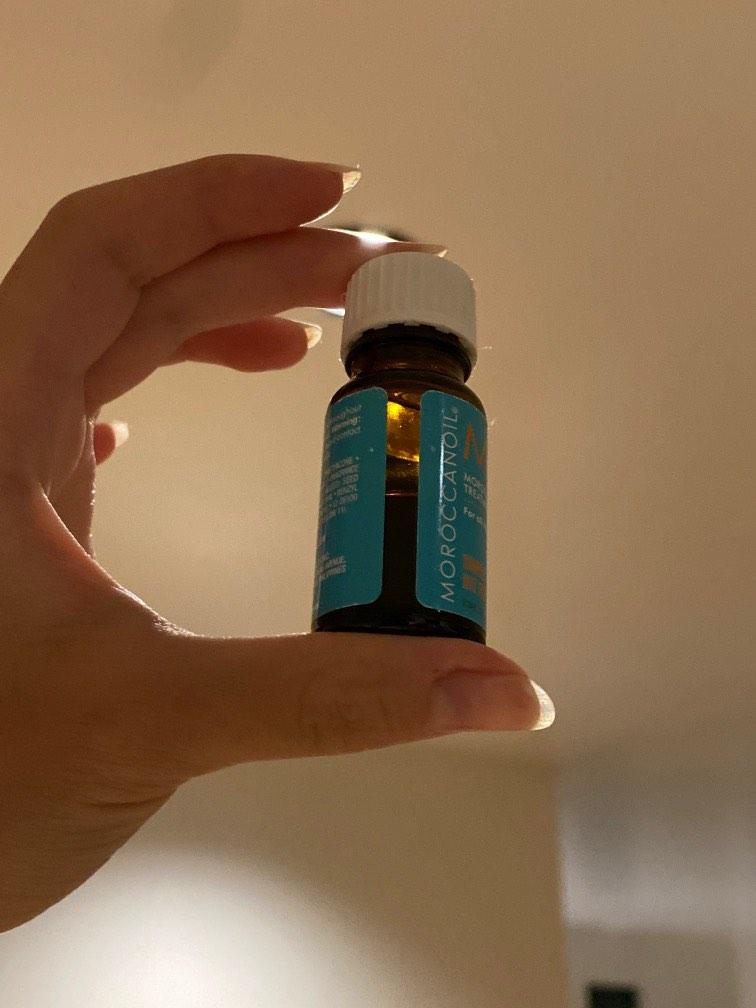 Moroccan Oil for Hair (Category: Hair) located in Paranaque City. Submitted by shopmyquahloset (Listing ID 1187920088, Image 2). Description: Half of the bottle used, around 5ml left but you dont need a lot per use since its a hair oil. Opened November 2021.