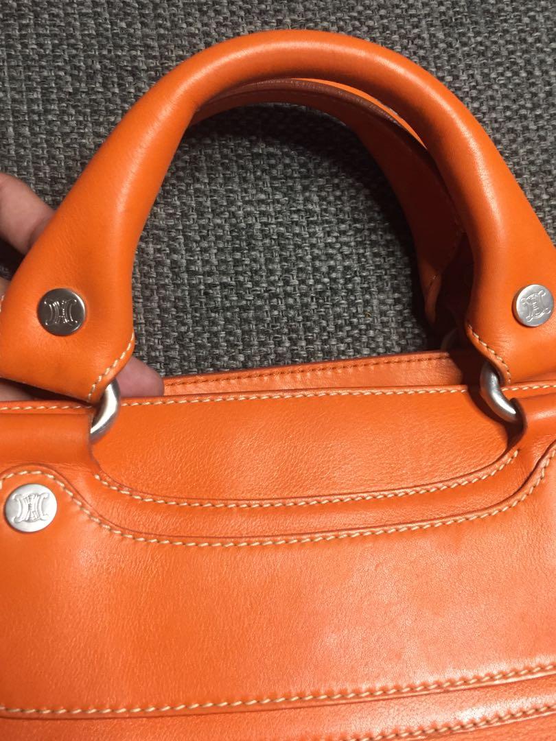 Celine Boogie Bag (Category: Luxury Bags & Wallets) located in Baguio. Submitted by BagstacularbyJCT (Listing ID 1182892341, Image 3). Description: Celine leather shoulderbag in orange colorway. Clean exterior and interior. Open top Three interior compartments. Middle compartment has zip closure. Slip pocket in interior. Minimal signs of use except for an undone stitch in one of the pockets. Size/Measurements (approx.) 12.5" length 5.5" depth 7.5