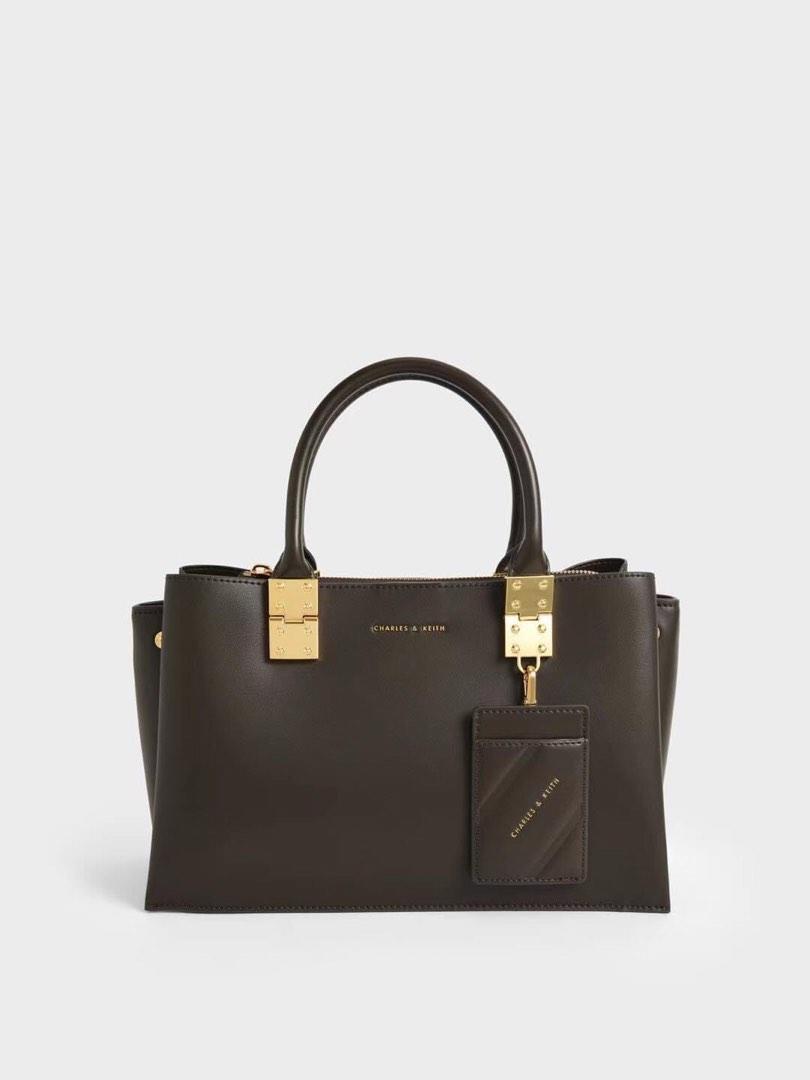 Charles & Keith Double Top Handle Structured Crossbody (Category: Cross-body Bags) located in Manila. Submitted by chic.collectivemnl (Listing ID 1182826365, Image 2). Description: Charles & Keith Double Top Handle Structured Crossbody Size: 30x12x18cm Colors: ultra black, light pink Price: 1,250 only!.