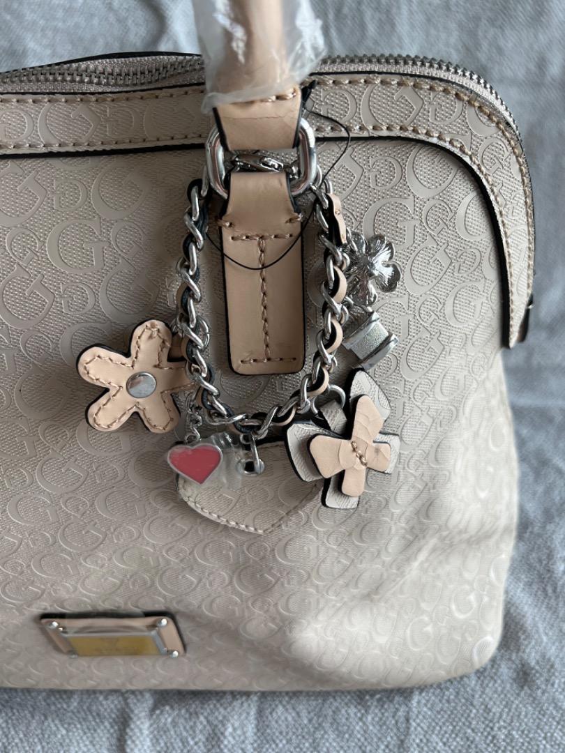Pink guess new arrivals purse with charms