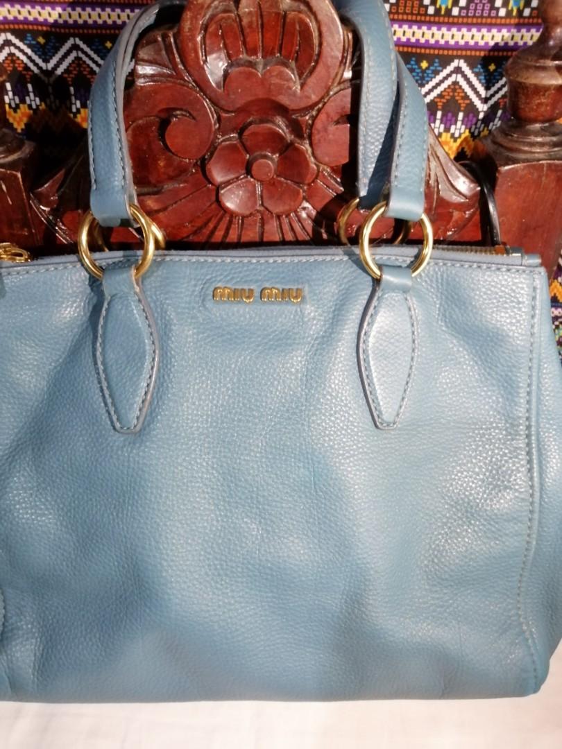 Preloved Miu Miu Blue Medium Size Bag (Category: Luxury Bags & Wallets) located in Quezon City. Submitted by CassyCrinkets (Listing ID 1182817312, Image 3). Description: Preloved Miu Miu Blue Medium Size Bag Soft leather Can fit a laptop from 13"-14" 3 zipper compartments (2sides and 1 inner) 1 original strap to convert to crossbody bag Minimal signs of usage.