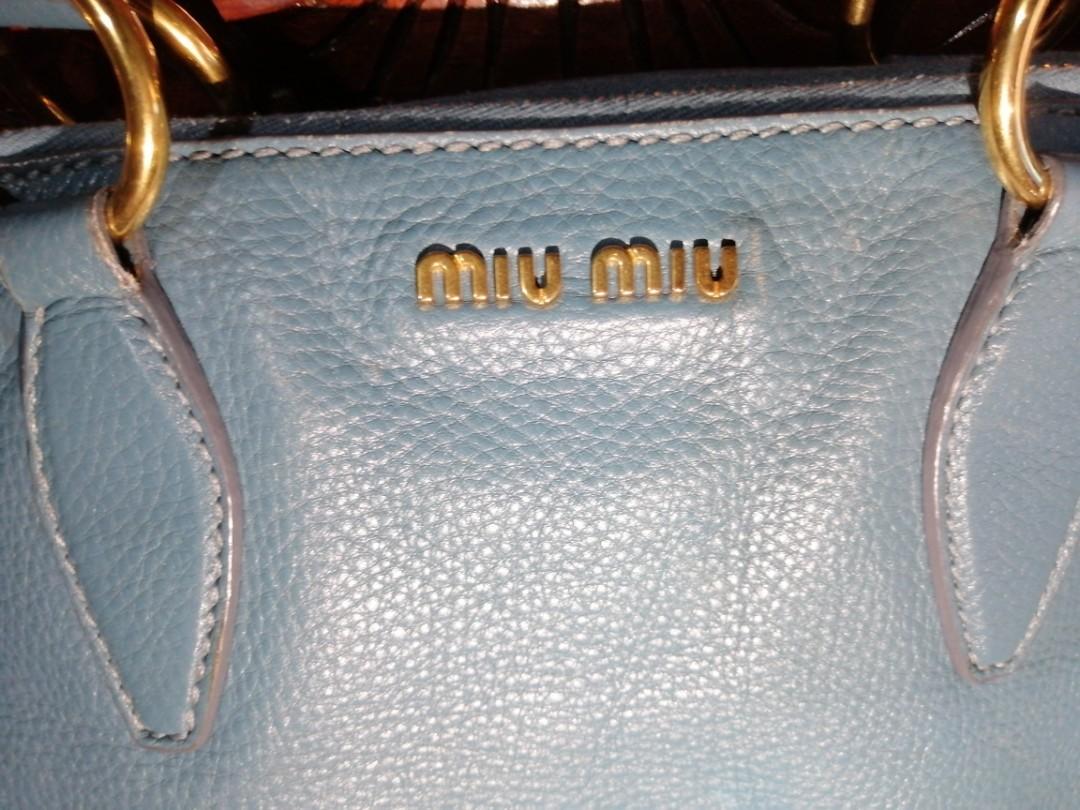 Preloved Miu Miu Blue Medium Size Bag (Category: Luxury Bags & Wallets) located in Quezon City. Submitted by CassyCrinkets (Listing ID 1182817312, Image 2). Description: Preloved Miu Miu Blue Medium Size Bag Soft leather Can fit a laptop from 13"-14" 3 zipper compartments (2sides and 1 inner) 1 original strap to convert to crossbody bag Minimal signs of usage.