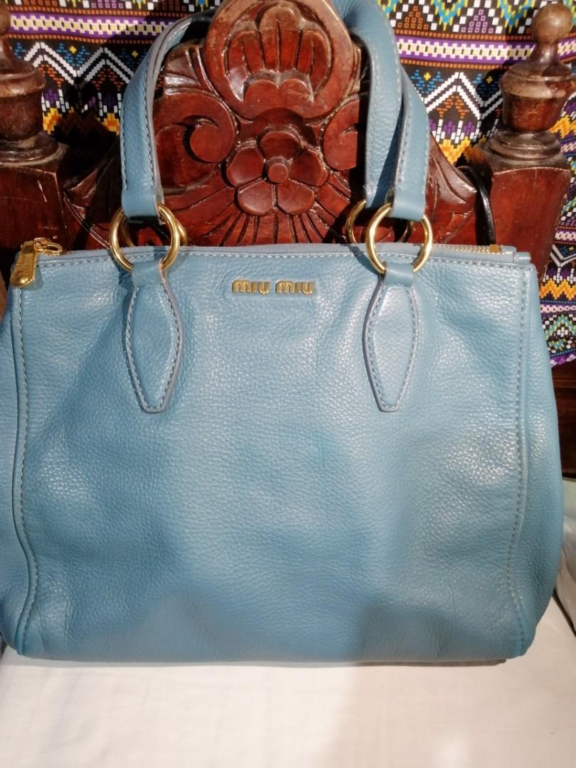 Preloved Miu Miu Blue Medium Size Bag (Category: Luxury Bags & Wallets) located in Quezon City. Submitted by CassyCrinkets (Listing ID 1182817312, Image 1). Description: Preloved Miu Miu Blue Medium Size Bag Soft leather Can fit a laptop from 13"-14" 3 zipper compartments (2sides and 1 inner) 1 original strap to convert to crossbody bag Minimal signs of usage.