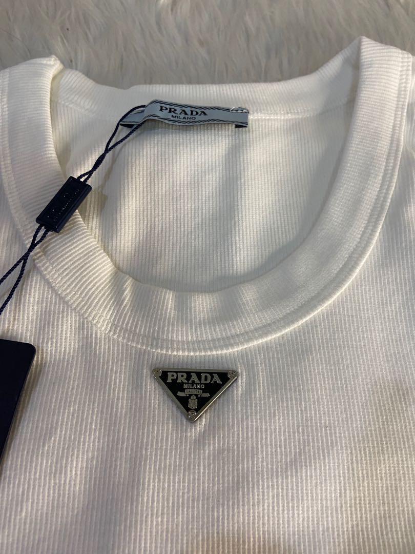Prada white tank top preorder (Category: Luxury Apparel) located in Mandaluyong City. Submitted by japanandsingaporeluxepreloved (Listing ID 1163217819, Image 2). Description: Can be tucked in for a cropped look All sizes are available for preorder Diclaimer: we are not associated with the brands that are linked and stated with this post. All copyrights are reserved to its brandowners . No infringement intended . Black on hand .