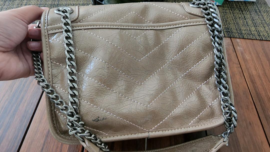 YSL Niki Small⁰ (Category: Luxury Bags & Wallets) located in Taguig. Submitted by closetdetoxmnl (Listing ID 1172982378, Image 2). Description: YSL Niki Small Used.