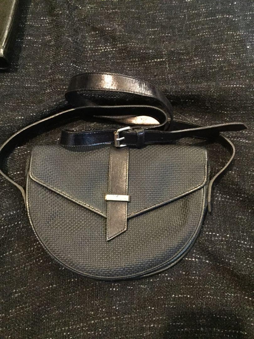 YSL Rive Gauche by Tom Ford (Category: Luxury Bags & Wallets) located in Baguio. Submitted by BagstacularbyJCT (Listing ID 1182893908, Image 2). Description: 90's YSL sling in knitted material, leather trims and straps, and silver hardware. Height 6.5 in /16.5 cm Width 8.86 in / 22.5 cm Depth 1.97 in / 5 cm reference: https://www.grailed.com/listings/37131084-vintage-x-ysl-rive-gauche-by-tom-ford-x-yves-saint-laurent-90s-ysl-yves-saint-laurent-cr