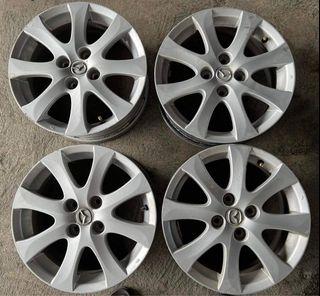 15” Mazda 2 stock used mags 4Holes pcd 100 sold as 4pcs