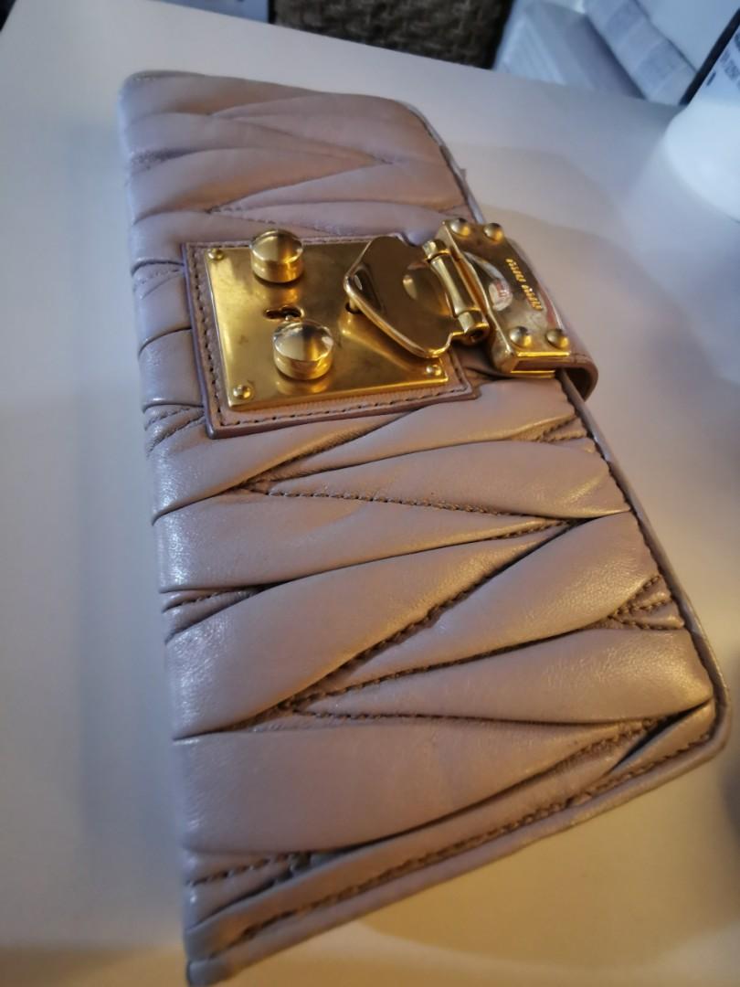Authentic Miu Miu long wallet (Category: Luxury Bags & Wallets) located in Malabon City. Submitted by vintagemom (Listing ID 1182955266, Image 3). Description: Well used pls see minor flaws.