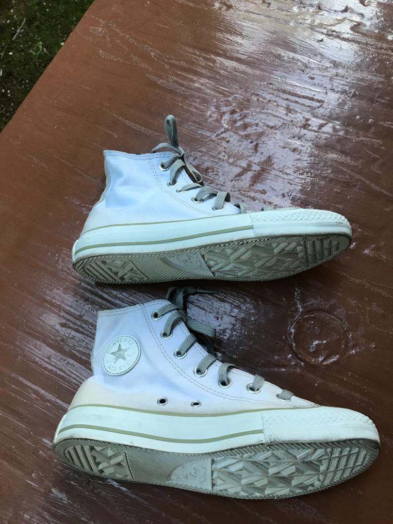 White leather converse sales with black stripe