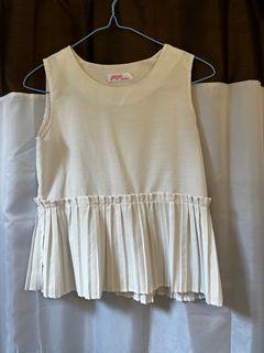 White sleeveless top