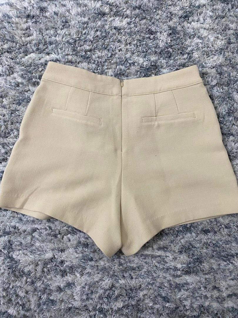 Beige high waist shorts (Category: Shorts) located in Mandaluyong City. Submitted by tenohthree (Listing ID 1183208451, Image 2). Description: Zipped behind, quality stretchy material. Waist is 26-28.