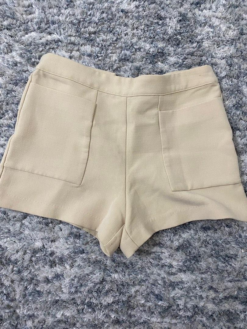 Beige high waist shorts (Category: Shorts) located in Mandaluyong City. Submitted by tenohthree (Listing ID 1183208451, Image 1). Description: Zipped behind, quality stretchy material. Waist is 26-28.