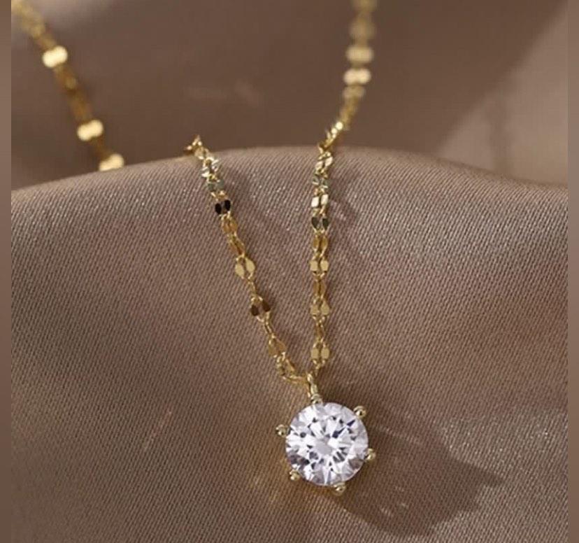 Gold necklace with one diamond sale