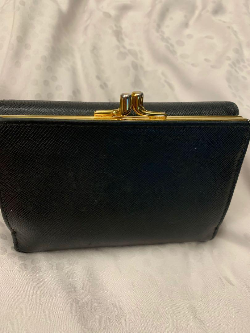 Prada wallet (Category: Bags & Wallets) located in Singapore. Submitted by sugarlemon (Listing ID 1183447607, Image 2). Description: Well used prada short wallet as shown in picture. 100% authentic, comes with box & authetic card..