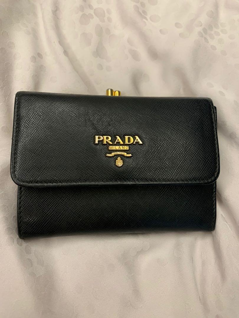 Prada wallet (Category: Bags & Wallets) located in Singapore. Submitted by sugarlemon (Listing ID 1183447607, Image 1). Description: Well used prada short wallet as shown in picture. 100% authentic, comes with box & authetic card..