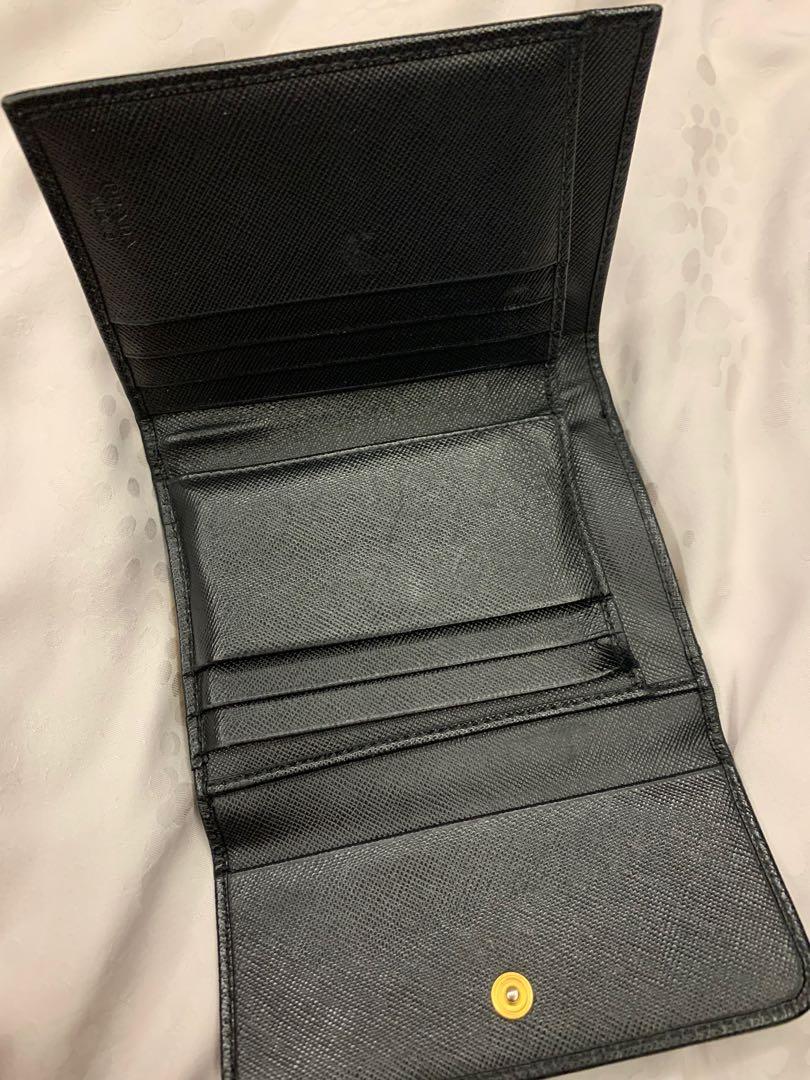 Prada wallet (Category: Bags & Wallets) located in Singapore. Submitted by sugarlemon (Listing ID 1183447607, Image 3). Description: Well used prada short wallet as shown in picture. 100% authentic, comes with box & authetic card..