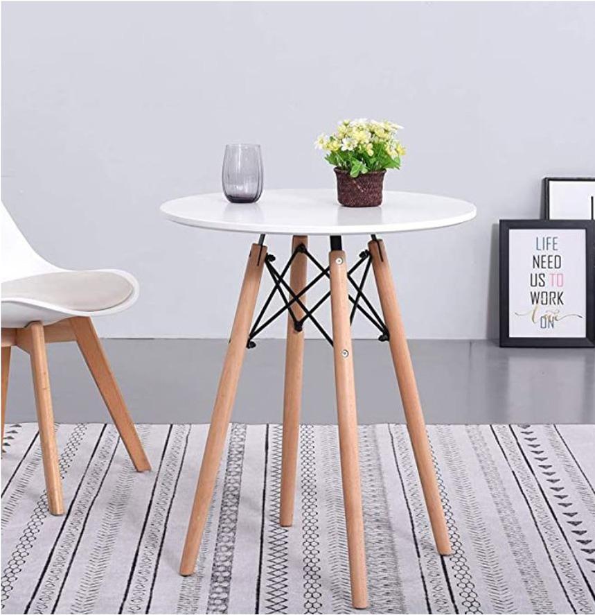 Scandinavian Round Coffee Dining Table (Category: Tables & Sets) located in Caloocan City. Submitted by psl_enterprise (Listing ID 1183512619, Image 1). Description: Scandinavian round coffee dining table Size: 60cm x 72cm (diameter x height) Color: White Material: Wood with steel frame and beech wood legs Ikea.