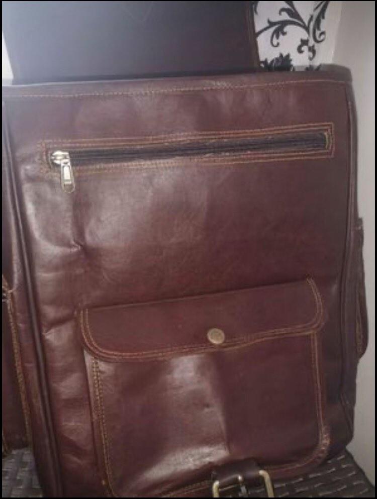 Authentic Genuine Leather Backpack (Category: Backpacks) located in Manila. Submitted by officialtheia (Listing ID 1183765344, Image 2). Description: Authentic Genuine Leather Backpack (UNISEX) BRANDNEW from Saudi P 3,000 2 side pockets 4 zipper pocket 2 Big compartment inside 2 front pocket Good for travelling! Dimensions: Length: 12inches Width: 4 inches Height: 15 inches Small laptop/Ipad can fit flaw: slit (last pic.) (already there when boug