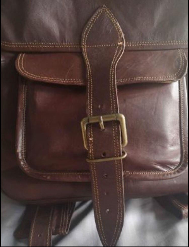 Authentic Genuine Leather Backpack (Category: Backpacks) located in Manila. Submitted by officialtheia (Listing ID 1183765344, Image 3). Description: Authentic Genuine Leather Backpack (UNISEX) BRANDNEW from Saudi P 3,000 2 side pockets 4 zipper pocket 2 Big compartment inside 2 front pocket Good for travelling! Dimensions: Length: 12inches Width: 4 inches Height: 15 inches Small laptop/Ipad can fit flaw: slit (last pic.) (already there when boug