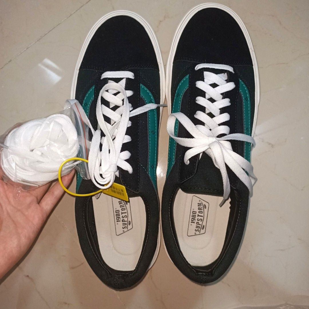 Black shoes with green stripes discount