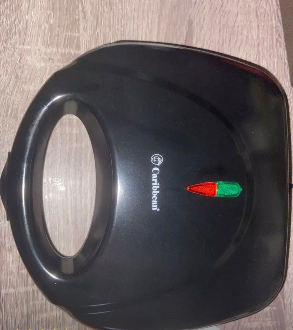 Caribbean Sandwich Maker (Category: Cookware & Accessories) located in Taguig. Submitted by annnnnnn_ (Listing ID 1206906707, Image 3). Description: Caribbean Sandwich Maker Bought from lazada Black RFS: not used anymore Box not included Price is slightly negotiable.