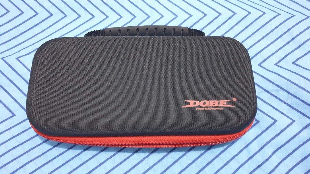 Dobe Carrying Case with free black case for Switch v1/v2 (Category: Cases & Covers) located in Quezon City. Submitted by hrk_icebear03 (Listing ID 1206771073, Image 1). Description: MOP: Gcash, bank transfer Payment first policy, last price posted. Buyer will shoulder sf. MOD: J&T (next day shipping, weekdays only).