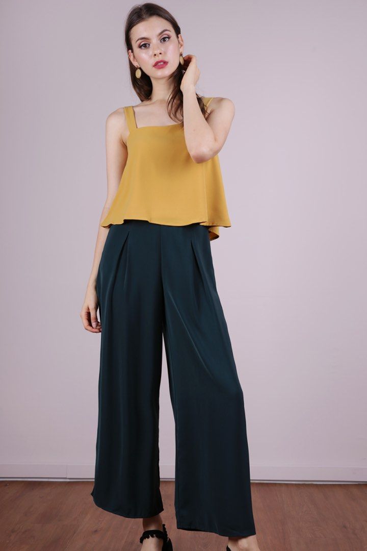 TTR Nixon Flare Top in Mustard Yellow (Category: Sleeveless) located in Singapore. Submitted by laughingcookys (Listing ID 1206809269, Image 2). Description: Worn twice Condition 10/10 No stains or defects Size S - see last pic for measurements A classic piece that can be paired with anything! No trades Item is true to pic so no additional photos will be provided Price excludes mail .