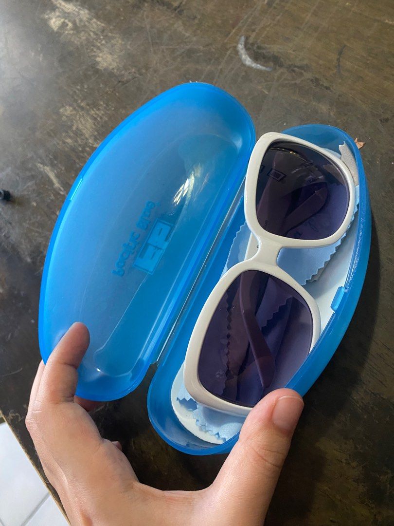 white frame sunglasses (Category: Sunglasses & Eyewear) located in Pasig City. Submitted by cyeli (Listing ID 1208749152, Image 3). Description: price negotiable comes with original case and wiping cloth.