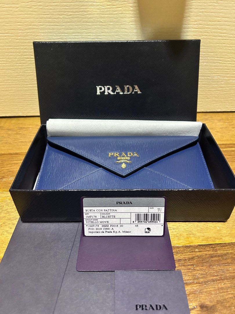 Prada Envelope Wallet (Category: Luxury Bags & Wallets) located in Subic. Submitted by riadg21 (Listing ID 1209011931, Image 2). Description: Lightly used Prada Envelope wallet in saffiano leather, blue with cards that came with the item. Bought in Japan. Negotiable..