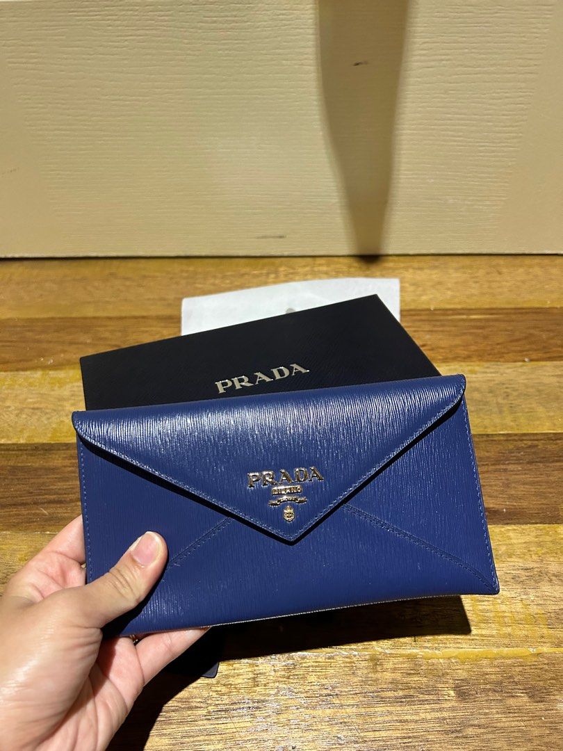 Prada Envelope Wallet (Category: Luxury Bags & Wallets) located in Subic. Submitted by riadg21 (Listing ID 1209011931, Image 3). Description: Lightly used Prada Envelope wallet in saffiano leather, blue with cards that came with the item. Bought in Japan. Negotiable..
