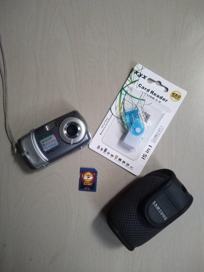 Samsung vintage camera (Category: Cameras) located in Las Pinas. Submitted by film101 (Listing ID 1208891826, Image 1). Description: 🌟Samsung Kenox D502 ✨Known as DIGIMAX 502 ✨5MP ✨With time stamp ✨Imptd purchase 🔹Its stylish and vintage style camera, its a smaller and compact type digital camera 🔹Still/videos 🔹Inclusion:orig samsung pouch, straps, memory card 256MB,card reader 🔺Batt AAx 2pcs not included ✨Condition of camera✨ 🔸Flash workin