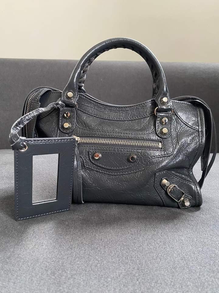 Balenciaga Mini City Bag (Category: Luxury Bags & Wallets) located in Manila. Submitted by bagislifeshop (Listing ID 1209246280, Image 2). Description: ▪️Balenciaga Mini City Bag▪️ ☑️Available in Pampanga ✅Condition: 8.5/10 ✅Material: lambskin ✅Color: anthracite in shw ✅Inclusions: replacement dustbag and long strap.