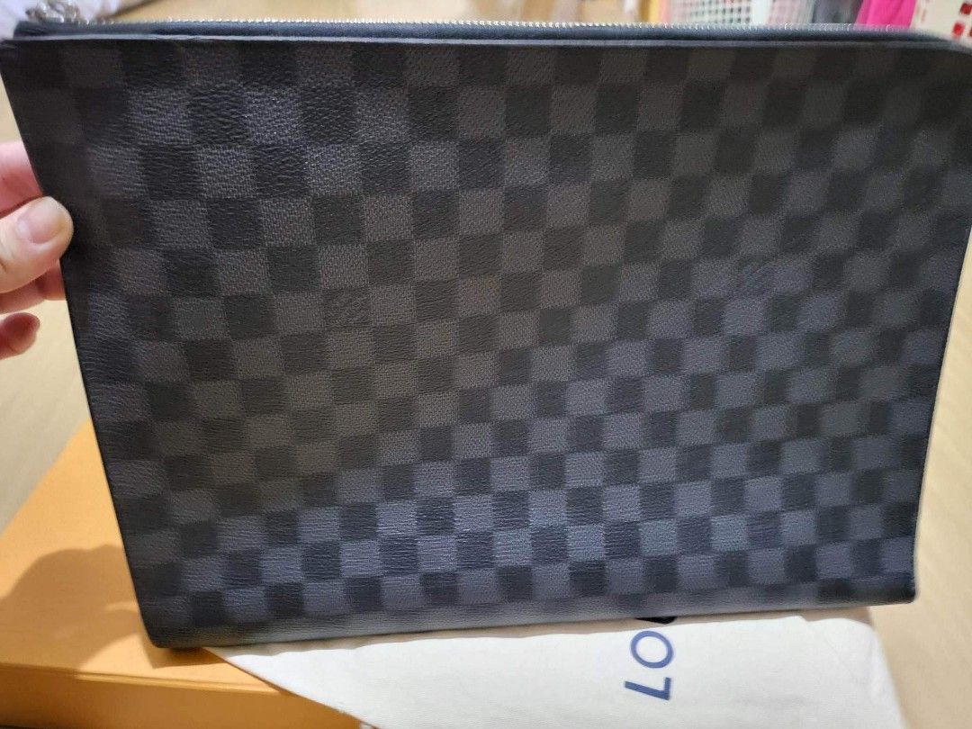 LV Clutch/laptop bag (Category: Clutches) located in Angeles City. Submitted by 3JSale (Listing ID 1209233836, Image 1). Description: Lv Damier Graphite clutch_ laptop bag for sale Bought at Solaire Ranked A dust bag + box Originally bought at 40k plus.