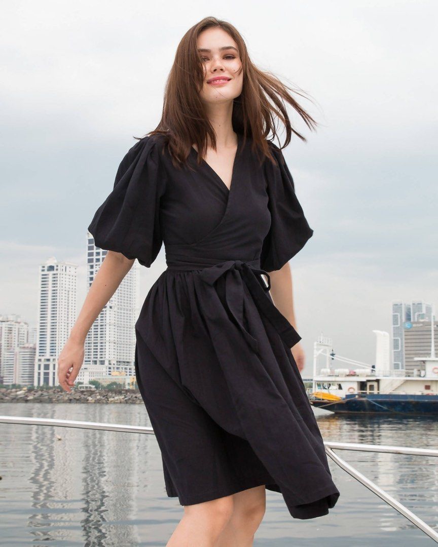 Puff Sleeve wrap Black Dress (Category: Dresses) located in Manila. Submitted by BrandedCornerOutlet (Listing ID 1209106467, Image 1). Description: Medium to large. Super nice. Naadjust ung belt so it can define your body shape😊 sexy tignan. Used many times na din since this is one of my fav. Dress☺️ rfs: need money for Taylor Swift concert. ps. color may slightly very due to photographic lighting pps. kindly visit my bio for seller’s policy. MA