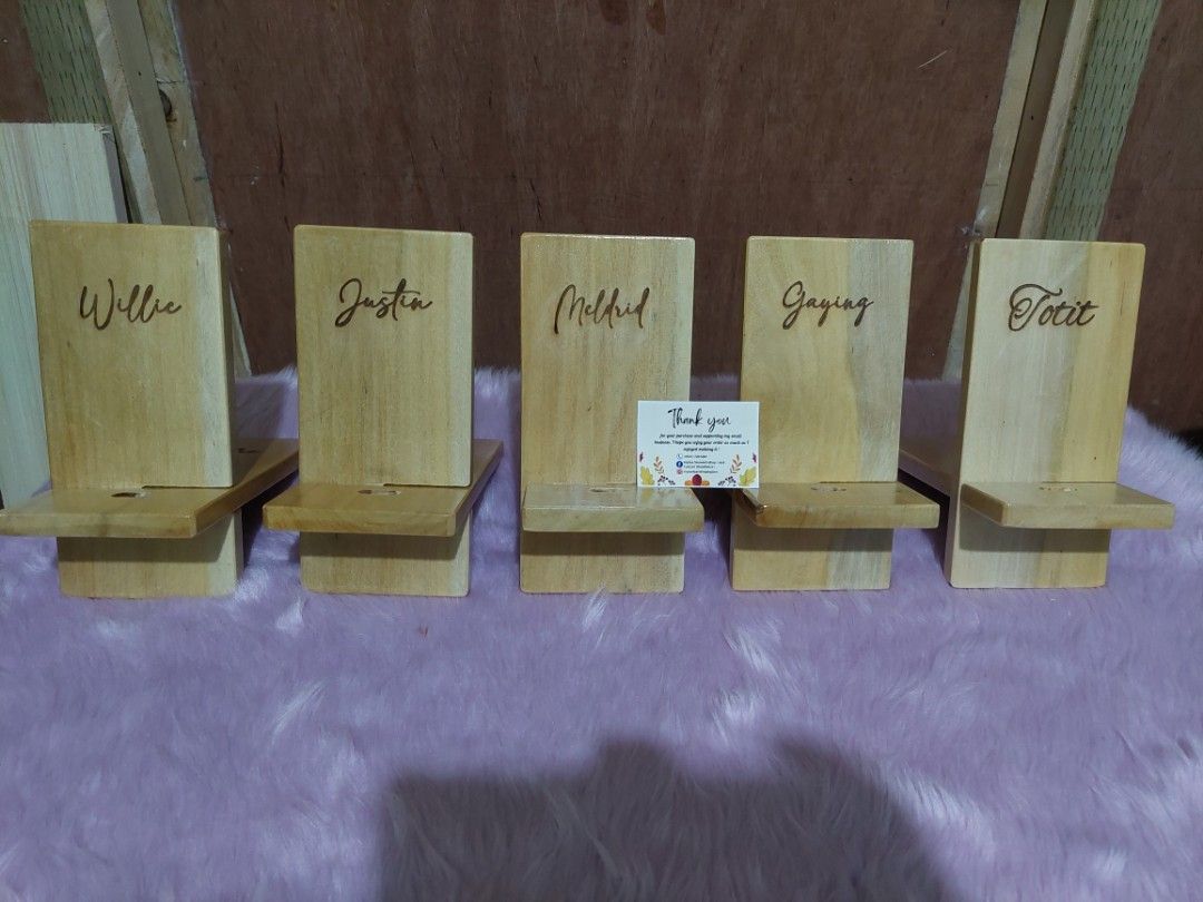 Wooden Cellphone/ Tablet Stand Personalized (Category: Other Accessories) located in Pasig City. Submitted by alyssascraftandwoodworx (Listing ID 1209099160, Image 1). Description: *Pre-order * Personalized Wooden Cellphone / Tablet Holder Stand ( Engrave Name) Type: Tablet Holder Material: Birch/Walnut Wood Compatible with: for iPhone/iPad/Samsung, for Other Tablet/Phones Features: Portable, Non-Slip, Universal, Stable Size: 3.75" x 7 H" x 1.5" 
