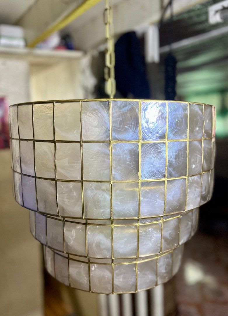 Capiz pendant light/lamp/lantern (Category: Lighting) located in Caloocan City. Submitted by casadisenyo (Listing ID 1209462783, Image 1). Description: Layered Capiz Pendant Light Size: 20"x16" With warm white light bulb MADE TO ORDER Handmade Made from PURE CAPIZ SHELLS.