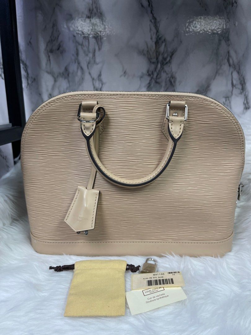 Louis Vuitton Nude Dune Epi Leather Alma PM Bag, Luxury, Bags & Wallets on  Carousell